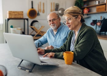 older couple looking at laptop