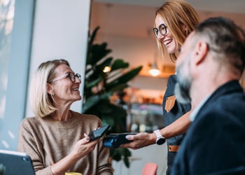 couple paying for meal at a restaurant