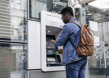 man using ATM