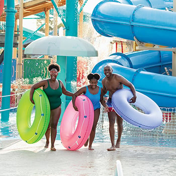 family playing at water park