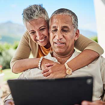 couple looking at laptop computer