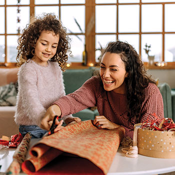 mother and daughter wrapping presents