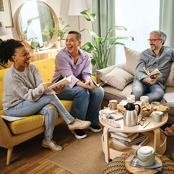 friends on couch laughing